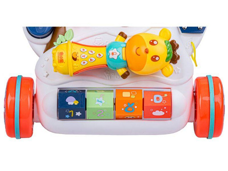 Edukacyjny muzyczny jeździk chodzik pchacz dla dzieci z zabawkami
